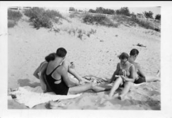A group of four beachgoers at Saugatuck